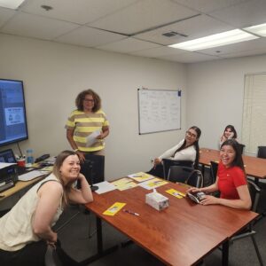 TAM Classroom with instructor and happy students